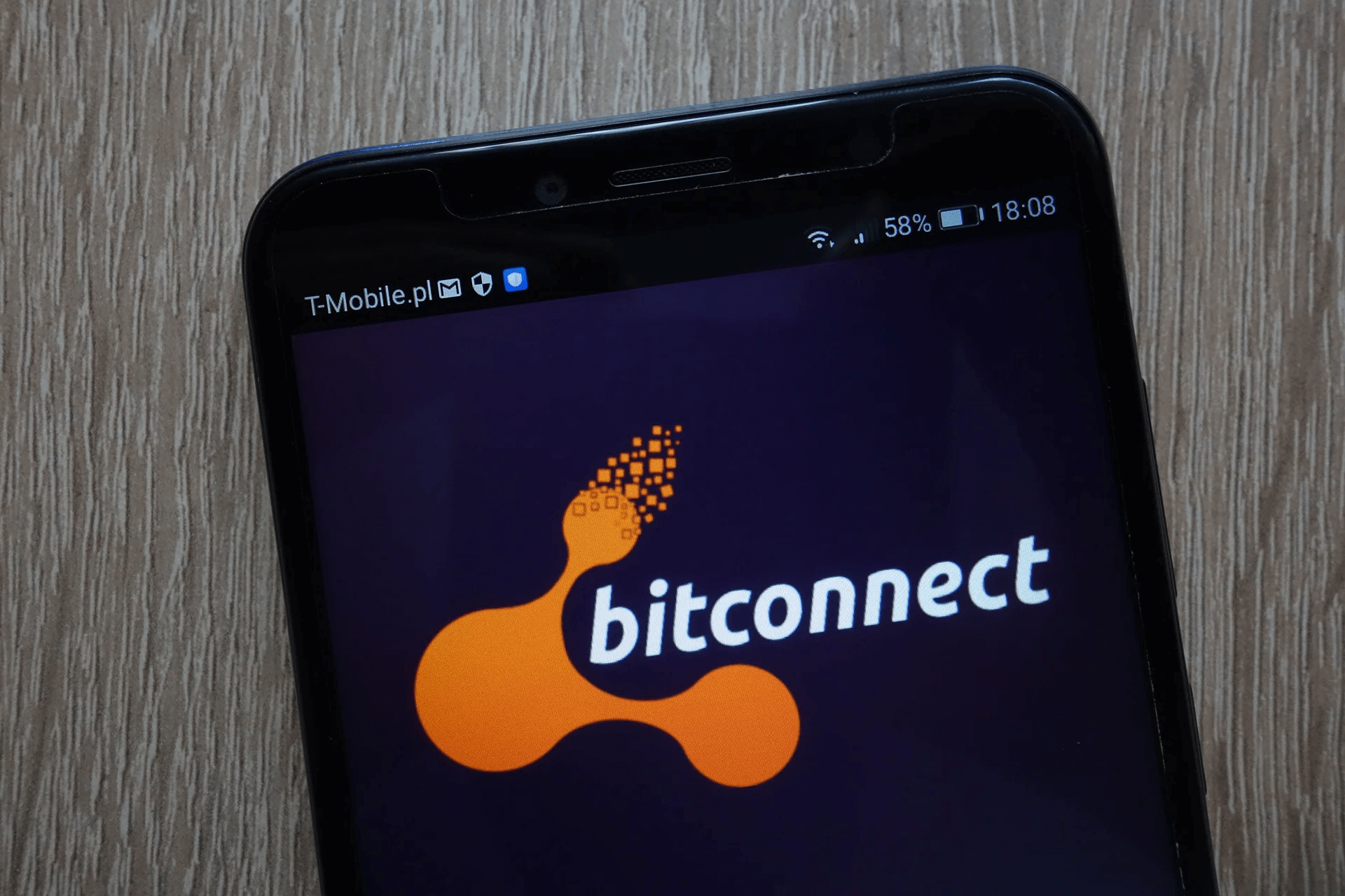 Smartphone screen displaying the BitConnect logo, a cryptocurrency platform known for its Ponzi scheme and subsequent collapse