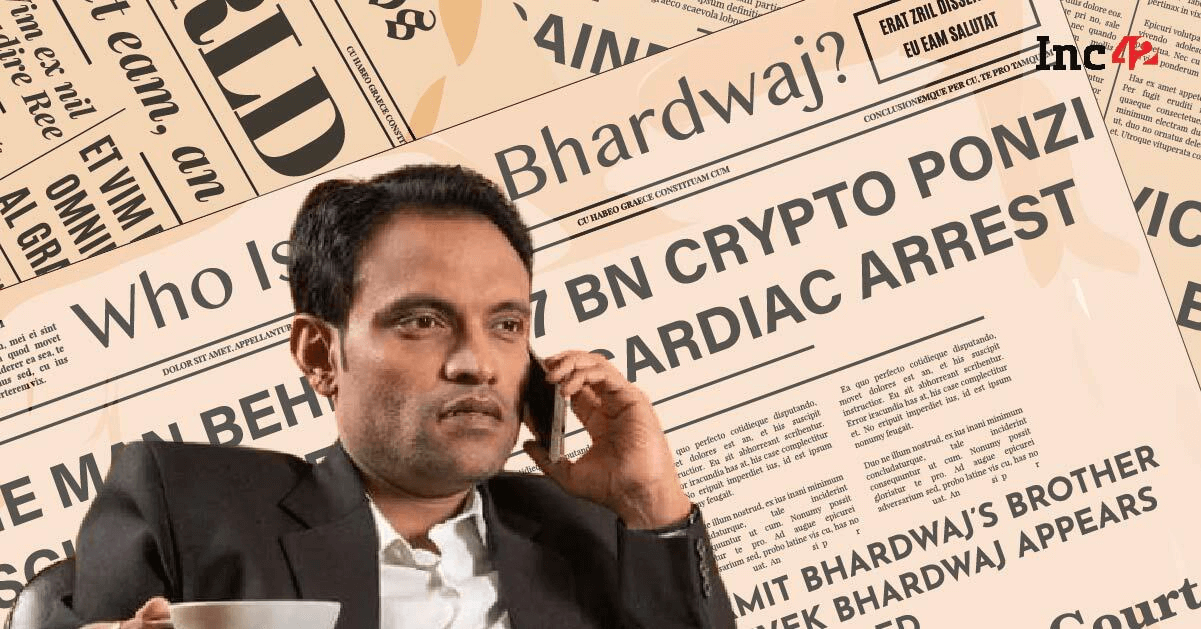 Amit Bhardwaj, founder of GainBitcoin, speaking on the phone with newspaper headlines in the background referencing his $7 billion crypto Ponzi scheme and cardiac arrest.
