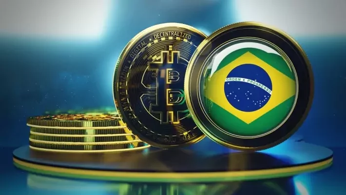 Moeda digital com símbolo do Bitcoin ao lado de uma criptomoeda com a bandeira do Brasil em destaque sobre pedestal iluminado.