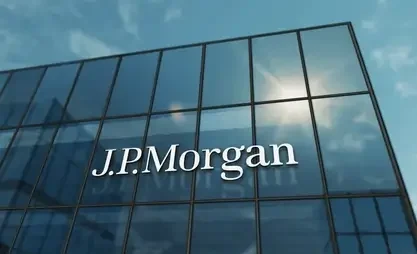 Glass facade of the J.P. Morgan headquarters reflecting the sky, with the financial institution's logo highlighted.